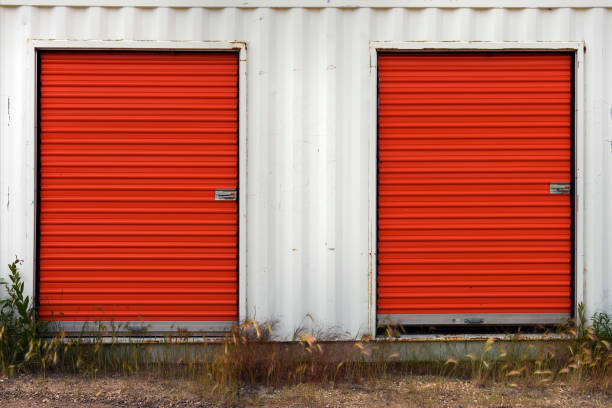 An image of a white storage unit with bright red doors.